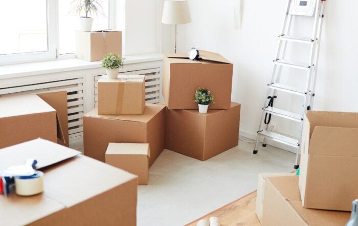 moving boxes and supplies in a white room